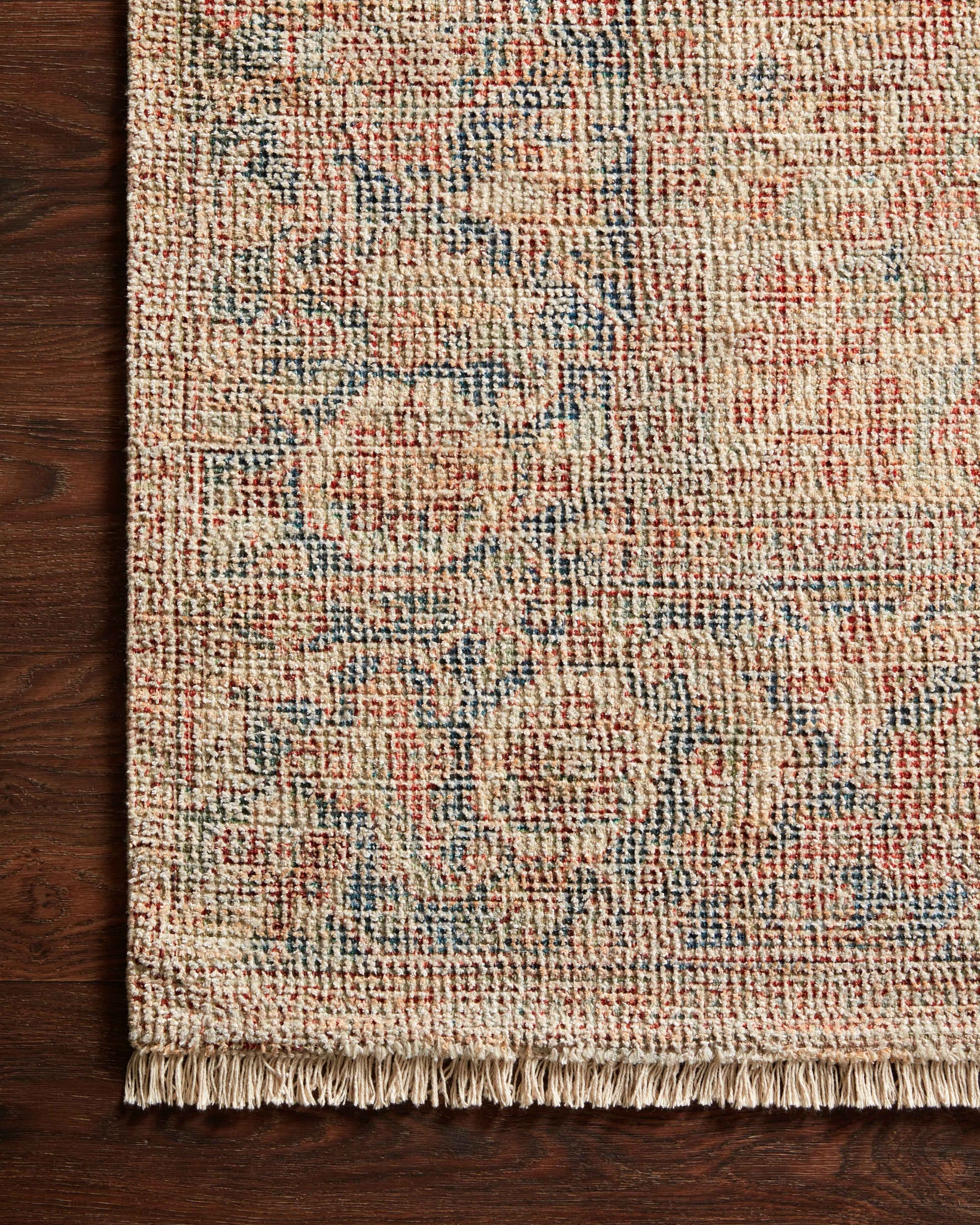 side view of Priya Brick / Navy luxury Rug
