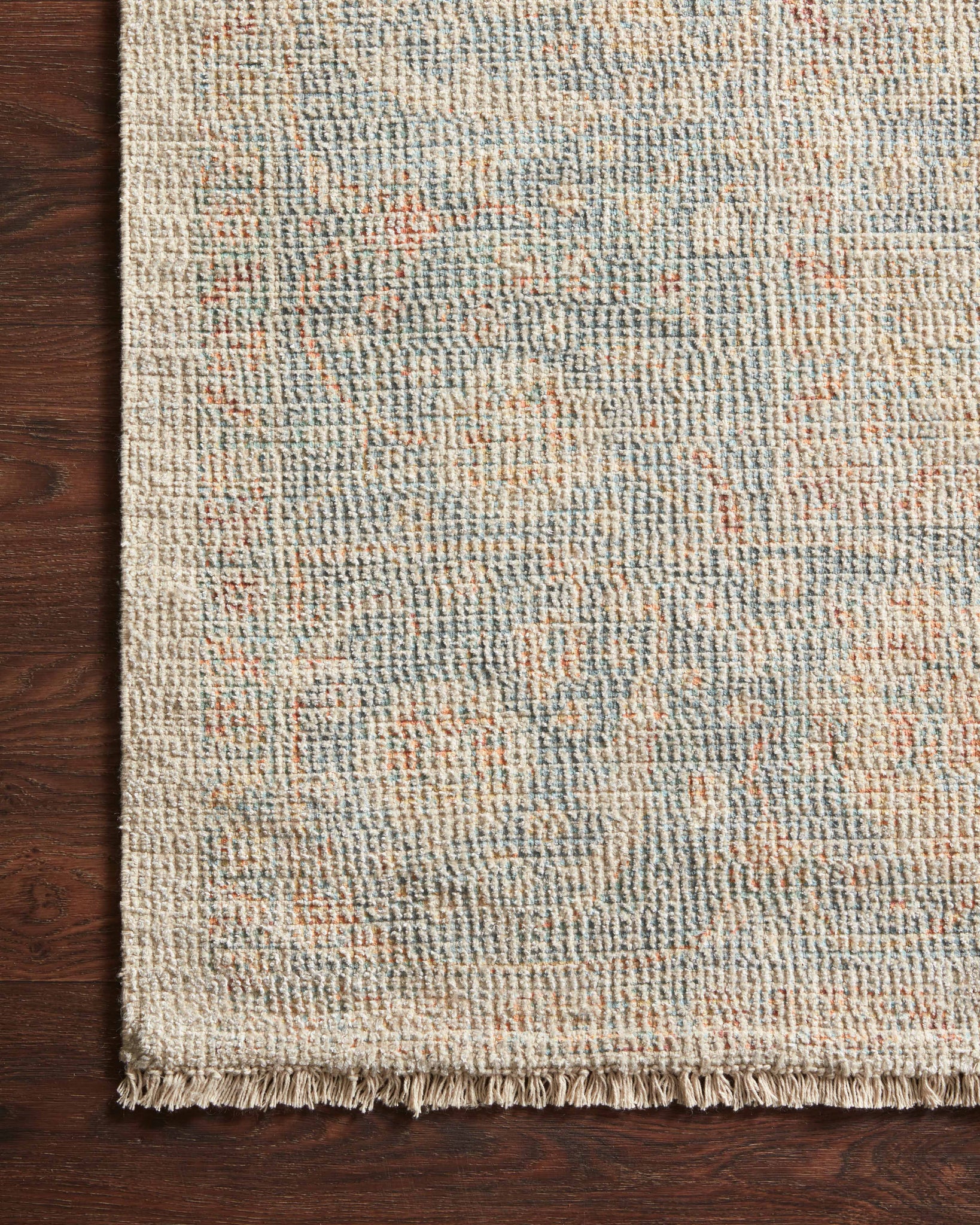 side view of Priya Bone / Bluestone luxury Rug