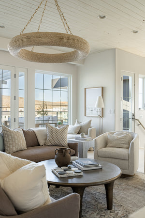 Pearce Floor Lamp styled in a bedroom for warm, layered light at Laurie Yapp Home.