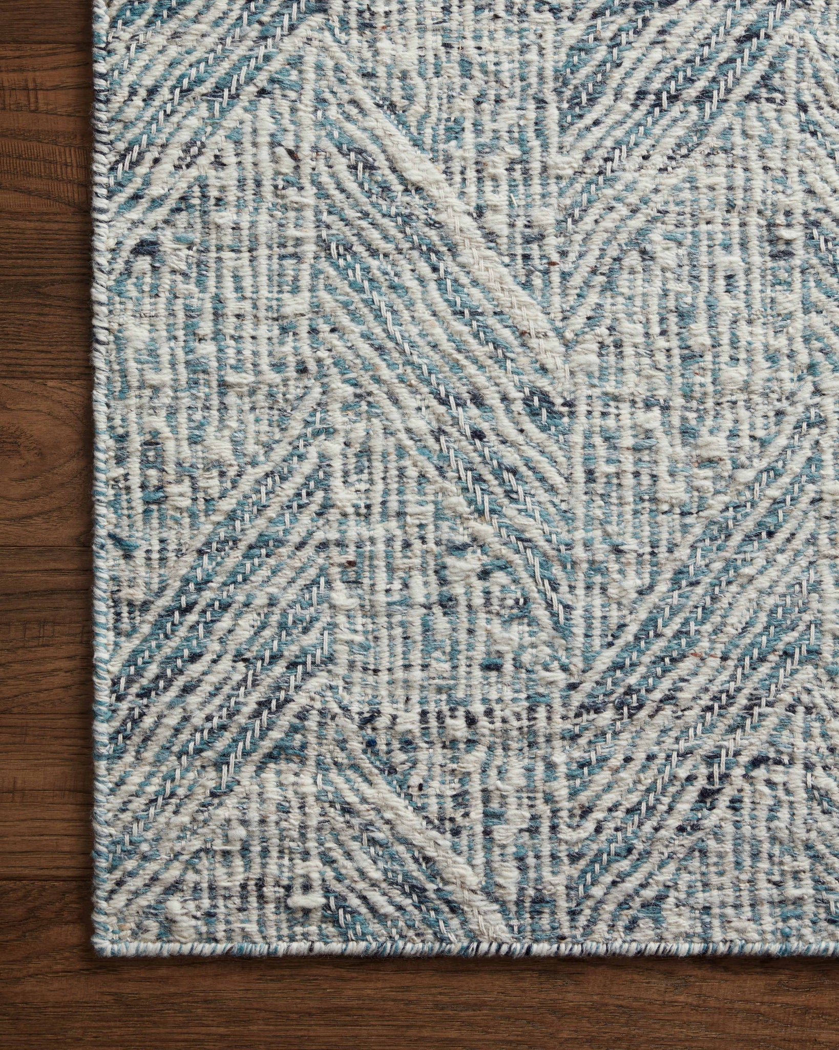 side view of Raven Blue / Ivory luxury Rug