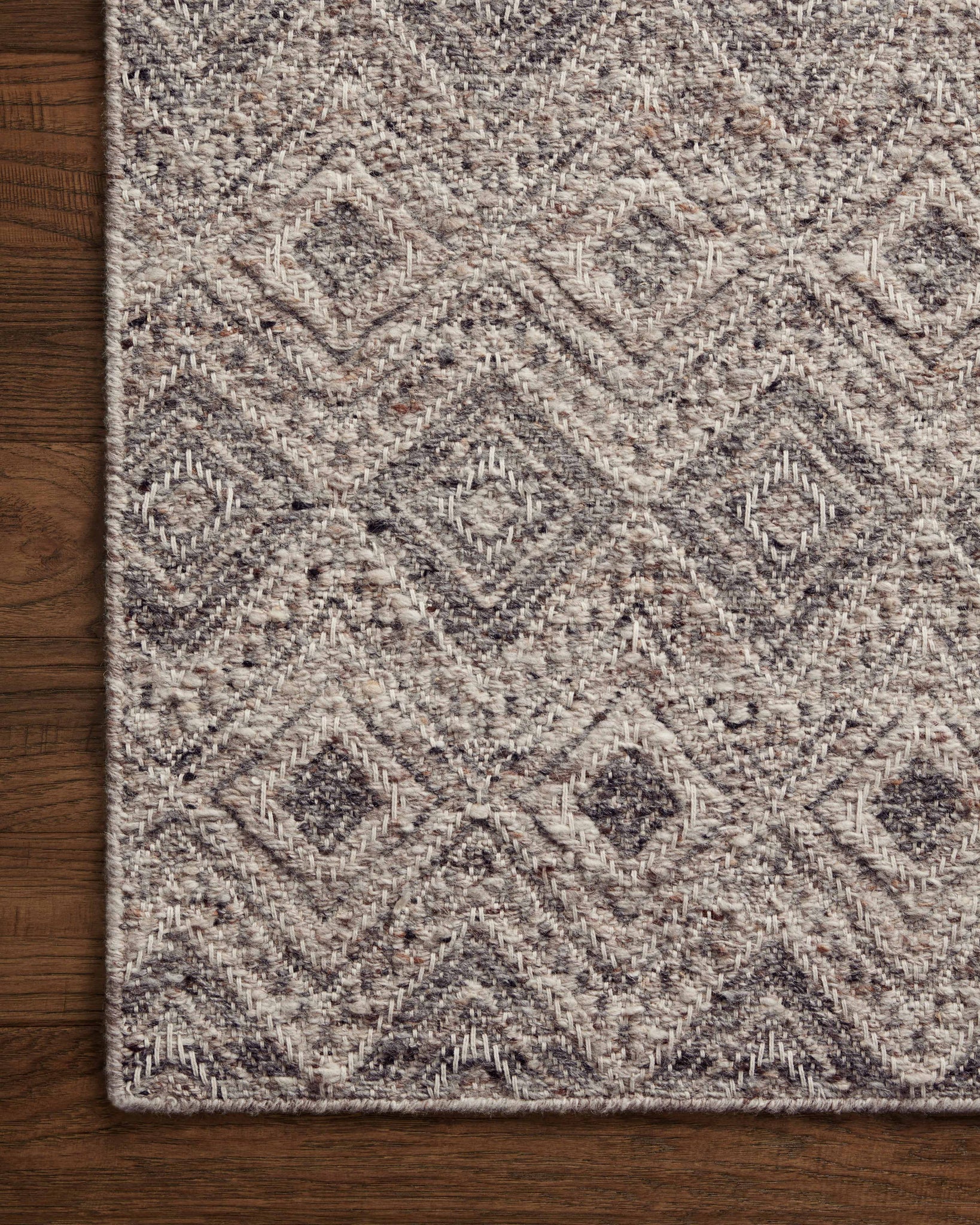 side view of Raven Taupe / Grey luxury Rug