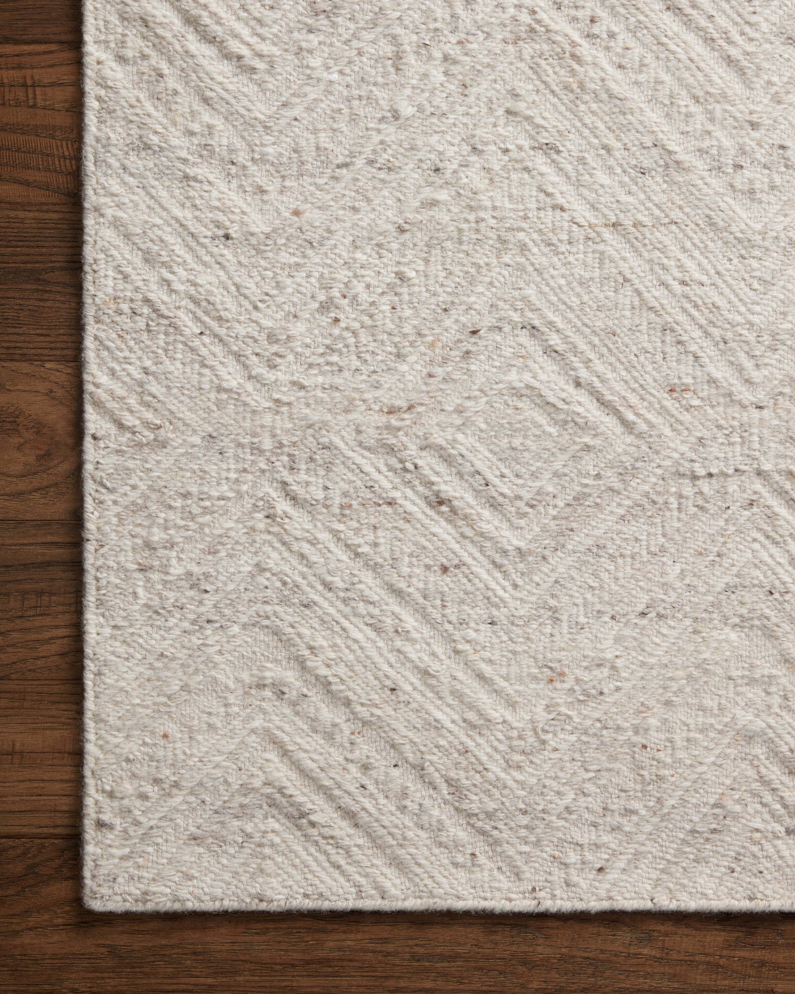 side view of Raven Ivory / Pebble luxury Rug