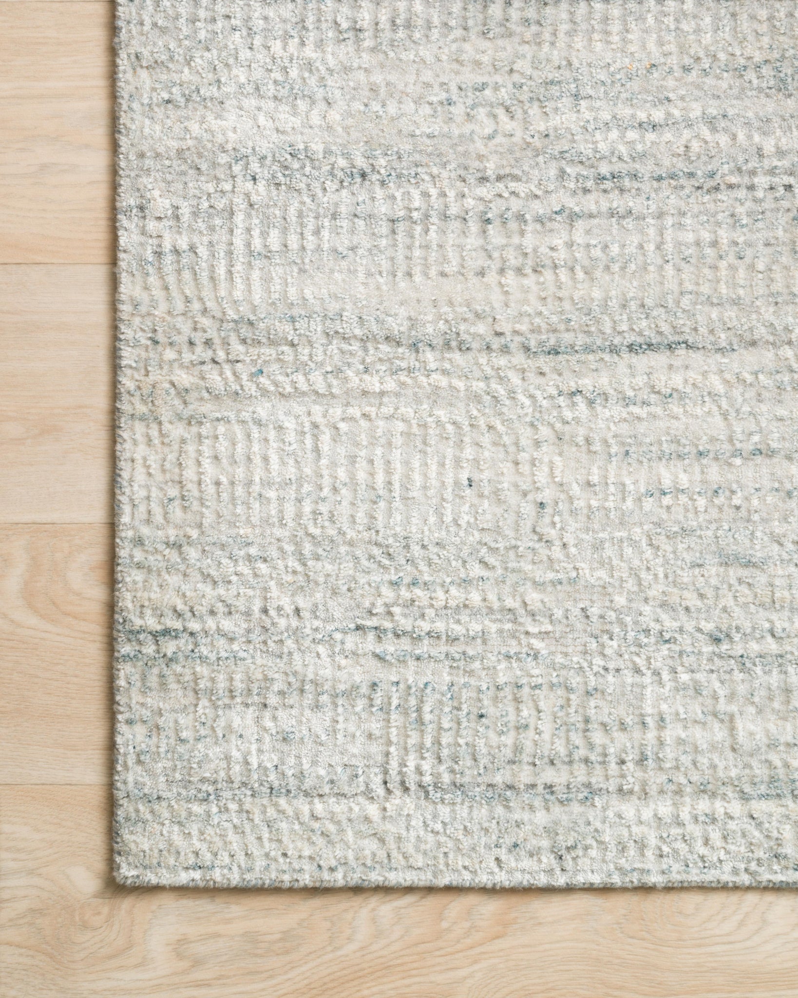 side view of Robin Silver luxury Rug