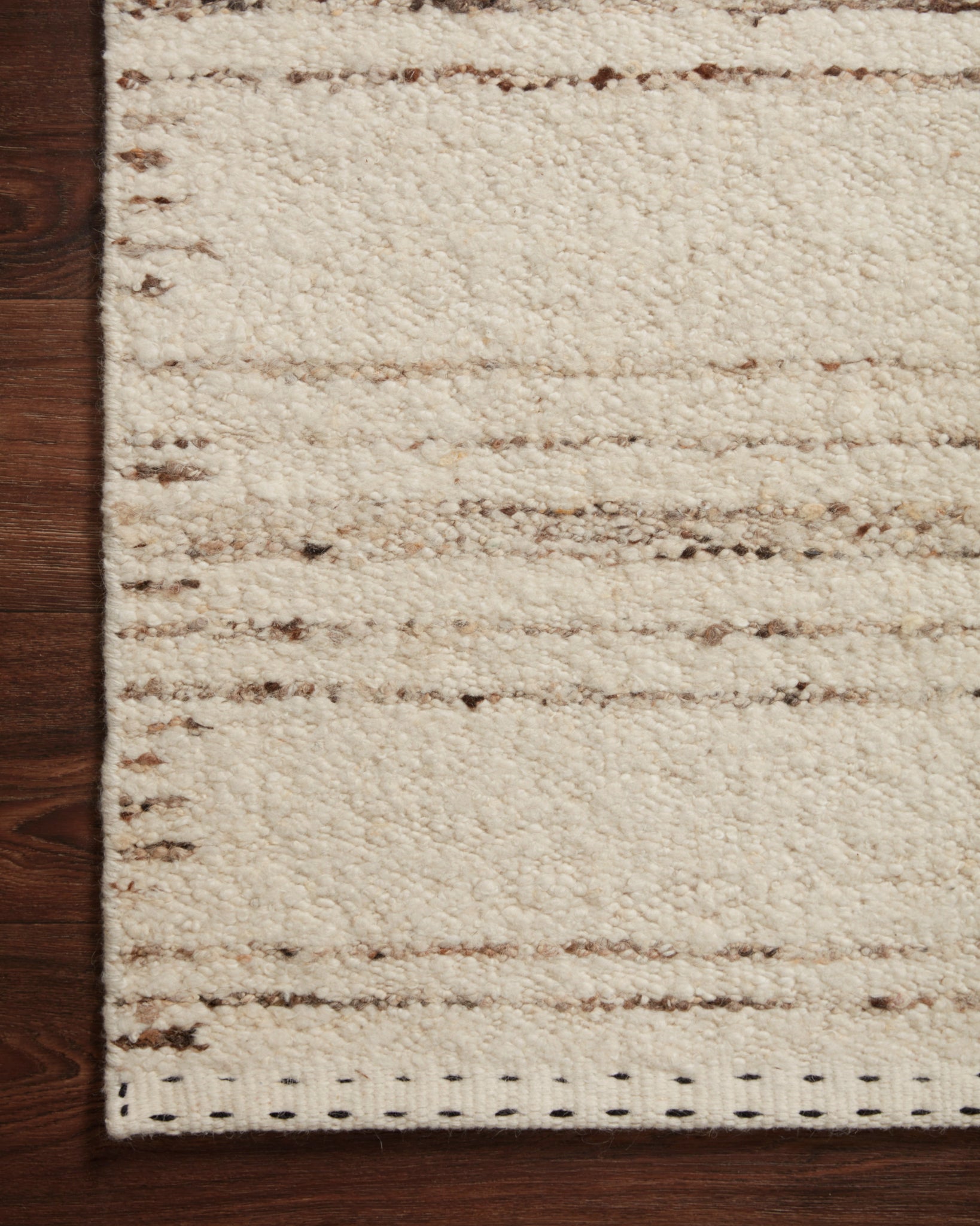 side view of Roman Ivory / Pebble luxury Rug