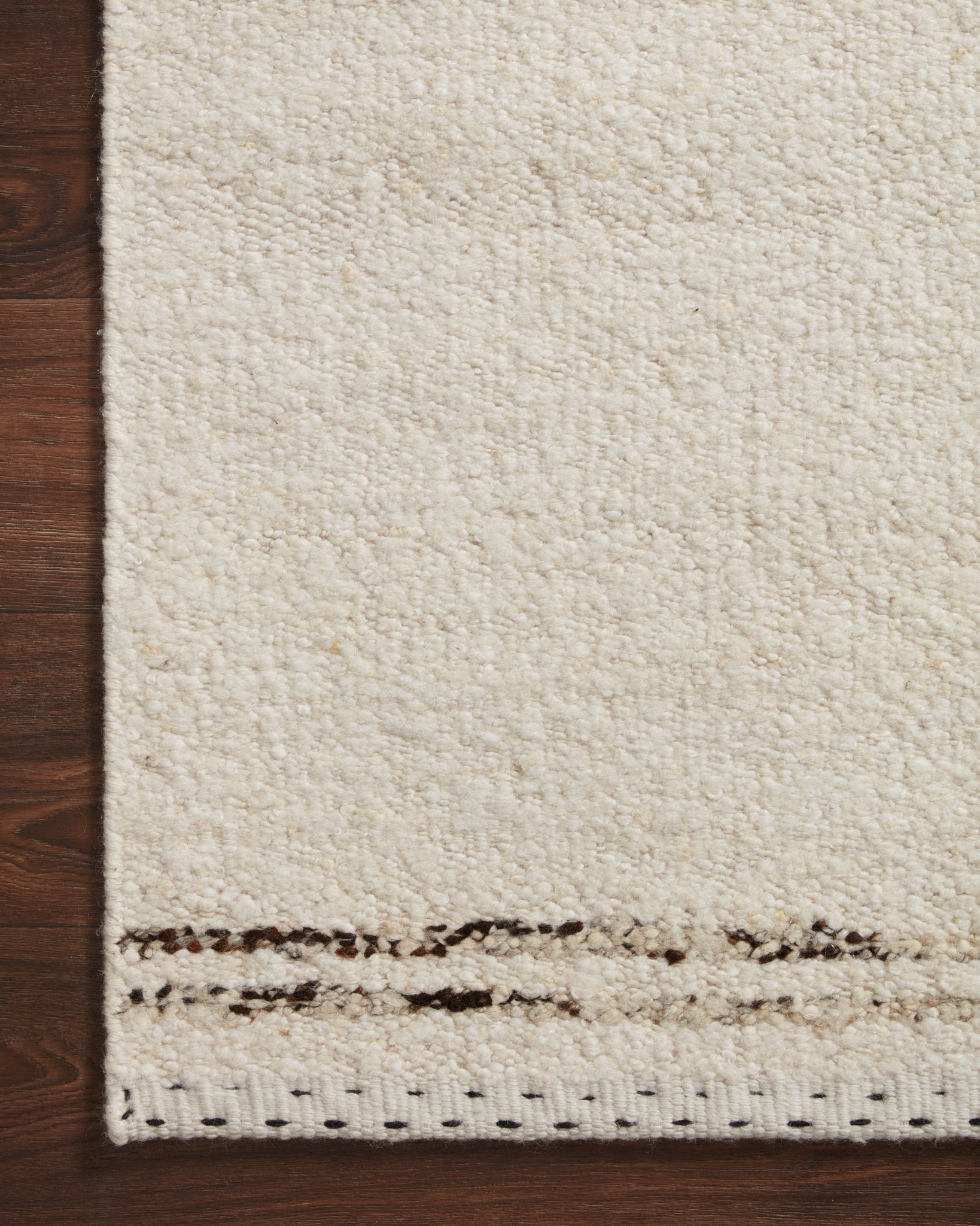 side view of Roman Ivory / Granite luxury Rug