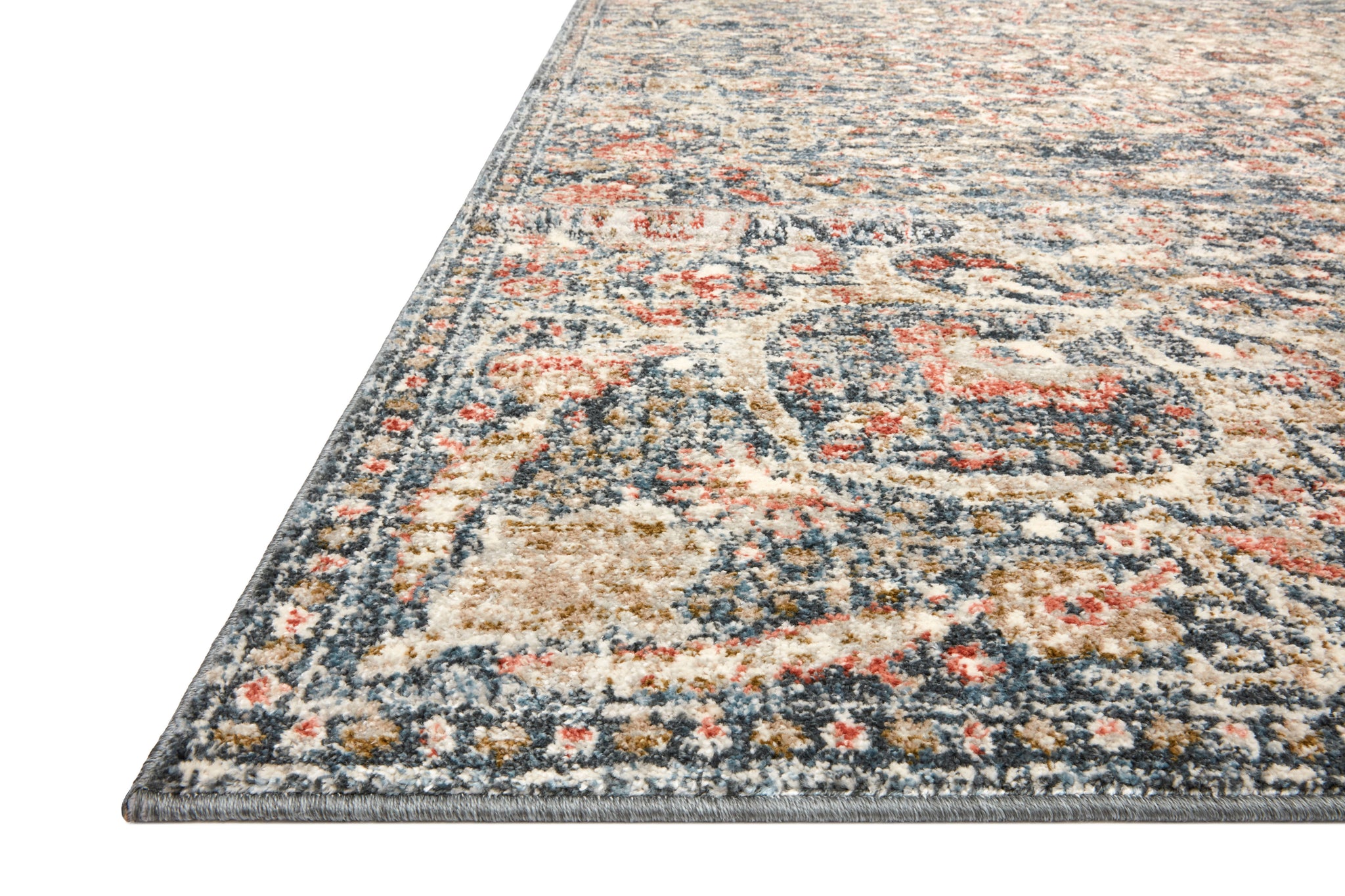 side view of Saban Blue / Spice luxury Rug
