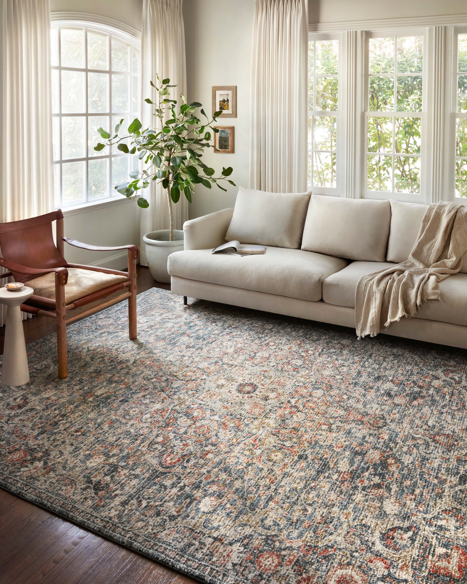 front view of Saban Blue / Spice luxury Rug