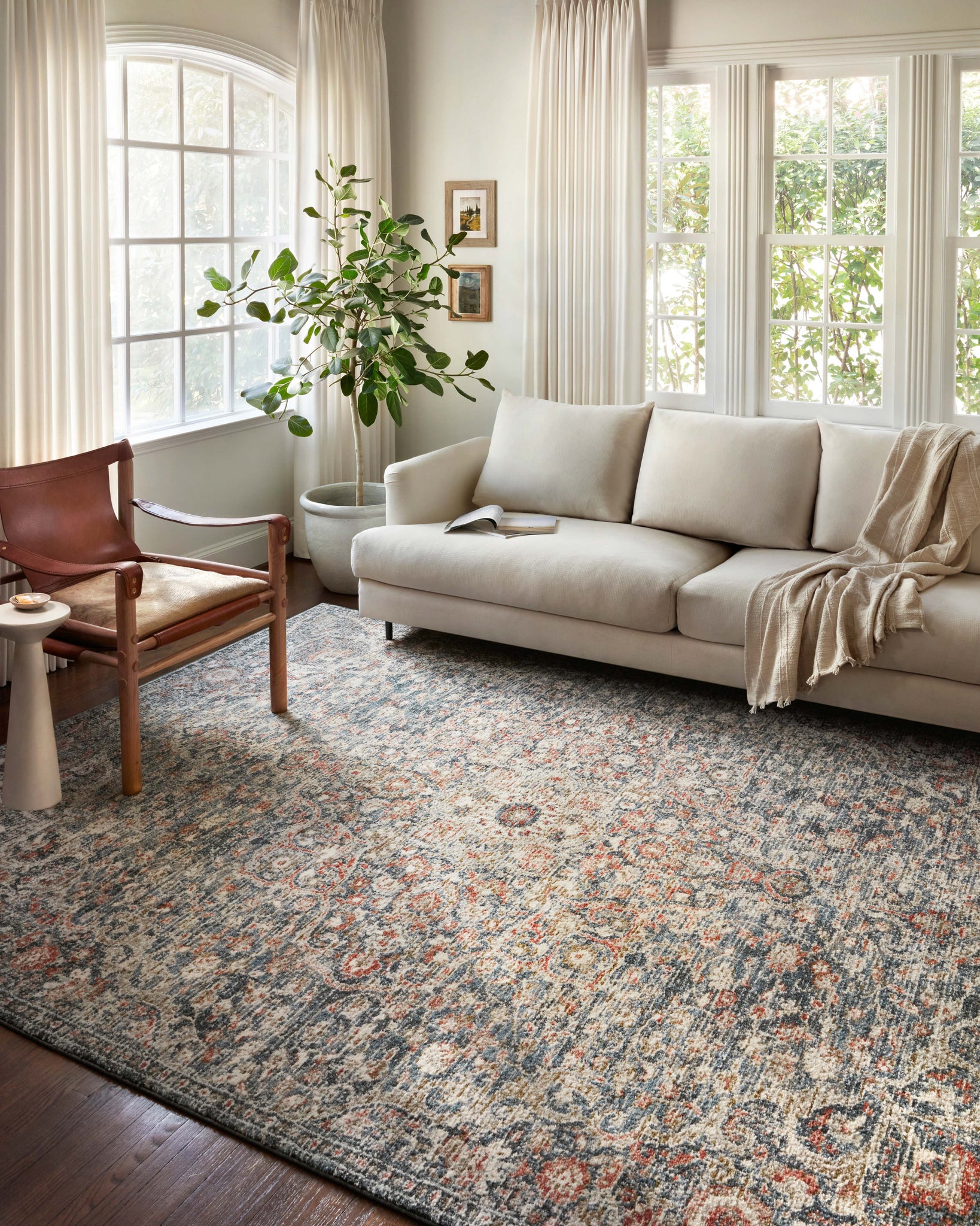 angle view of Saban Blue / Spice luxury Rug