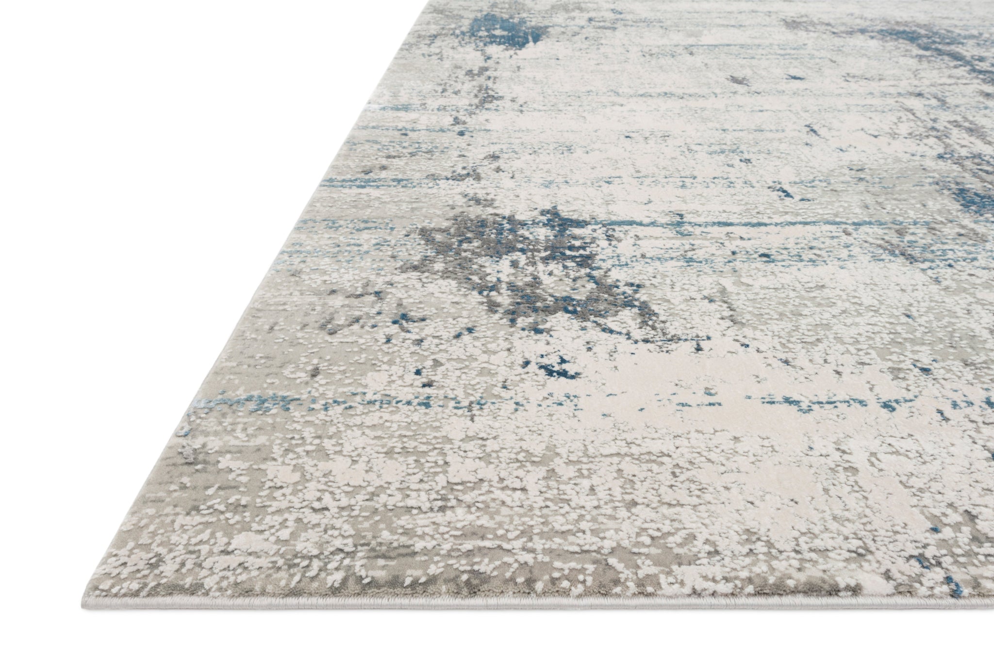 angle view of Sienne Ivory / Ocean luxury Rug
