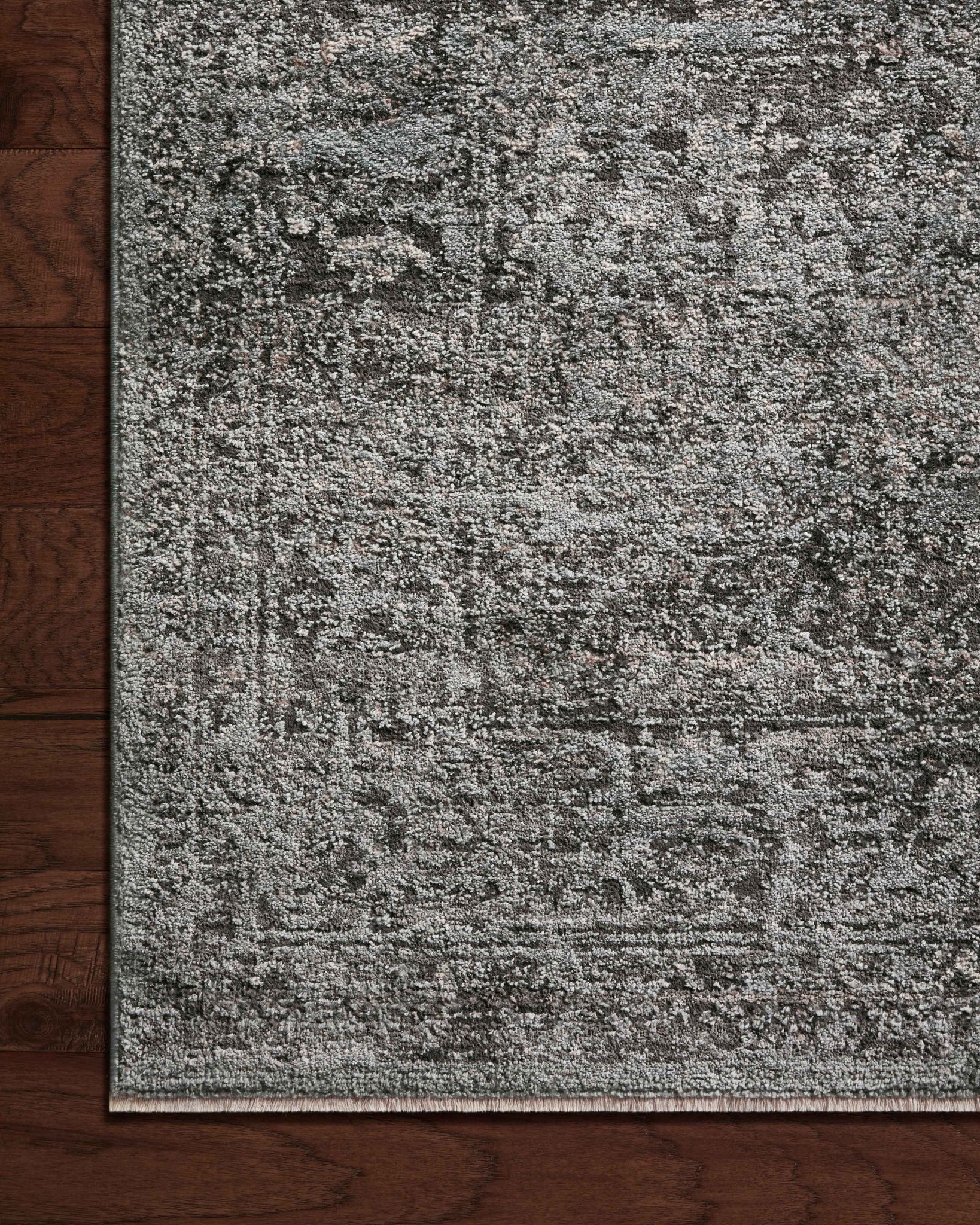 side view of Sonnet Charcoal / Mist luxury Rug