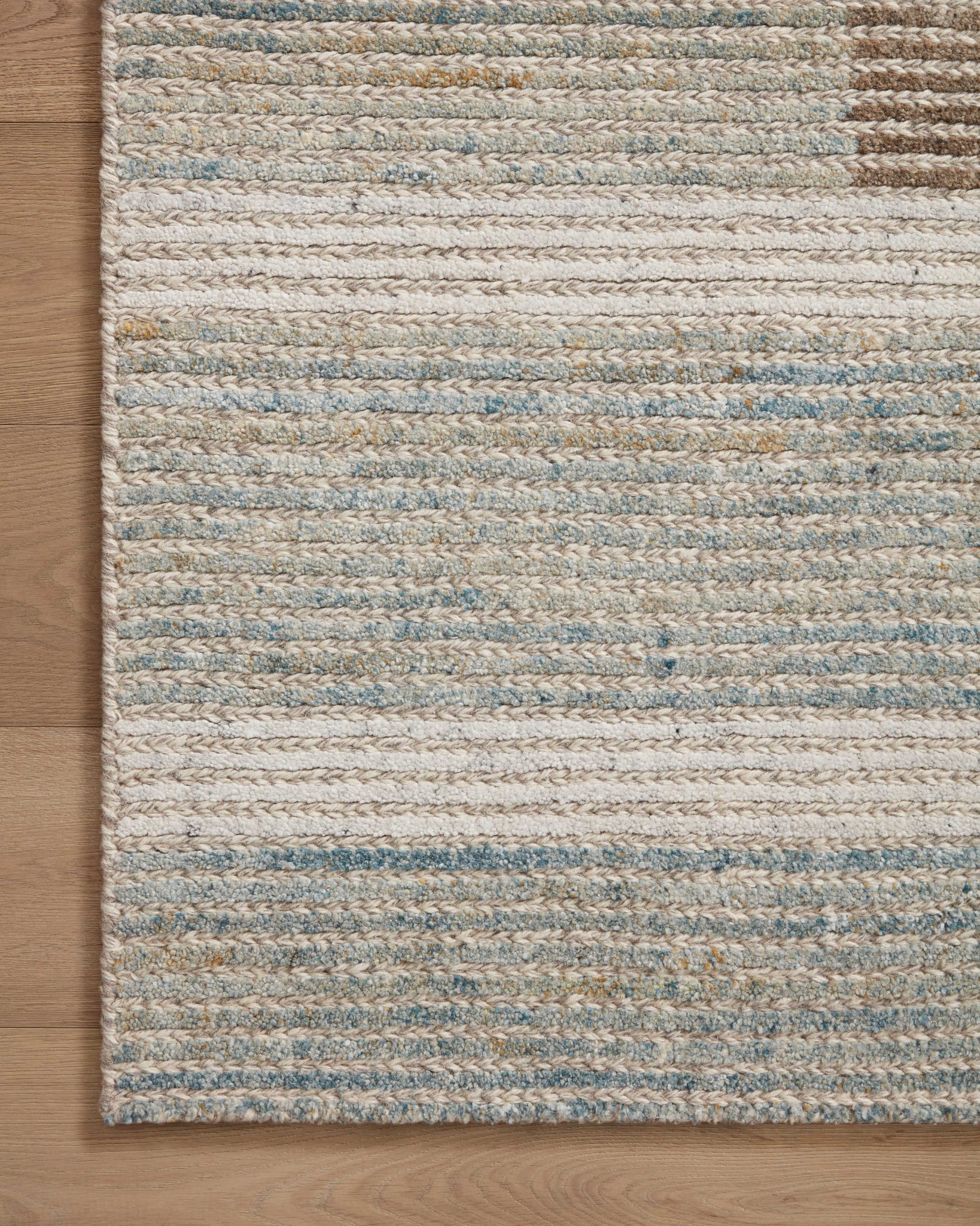 detail view of Stiles Tobacco / Lagoon luxury Rug