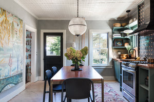 Sphere No. 3 Pendant 18.25" in dark bronze styled in a welcoming entryway for warm, layered light at Laurie Yapp Home.