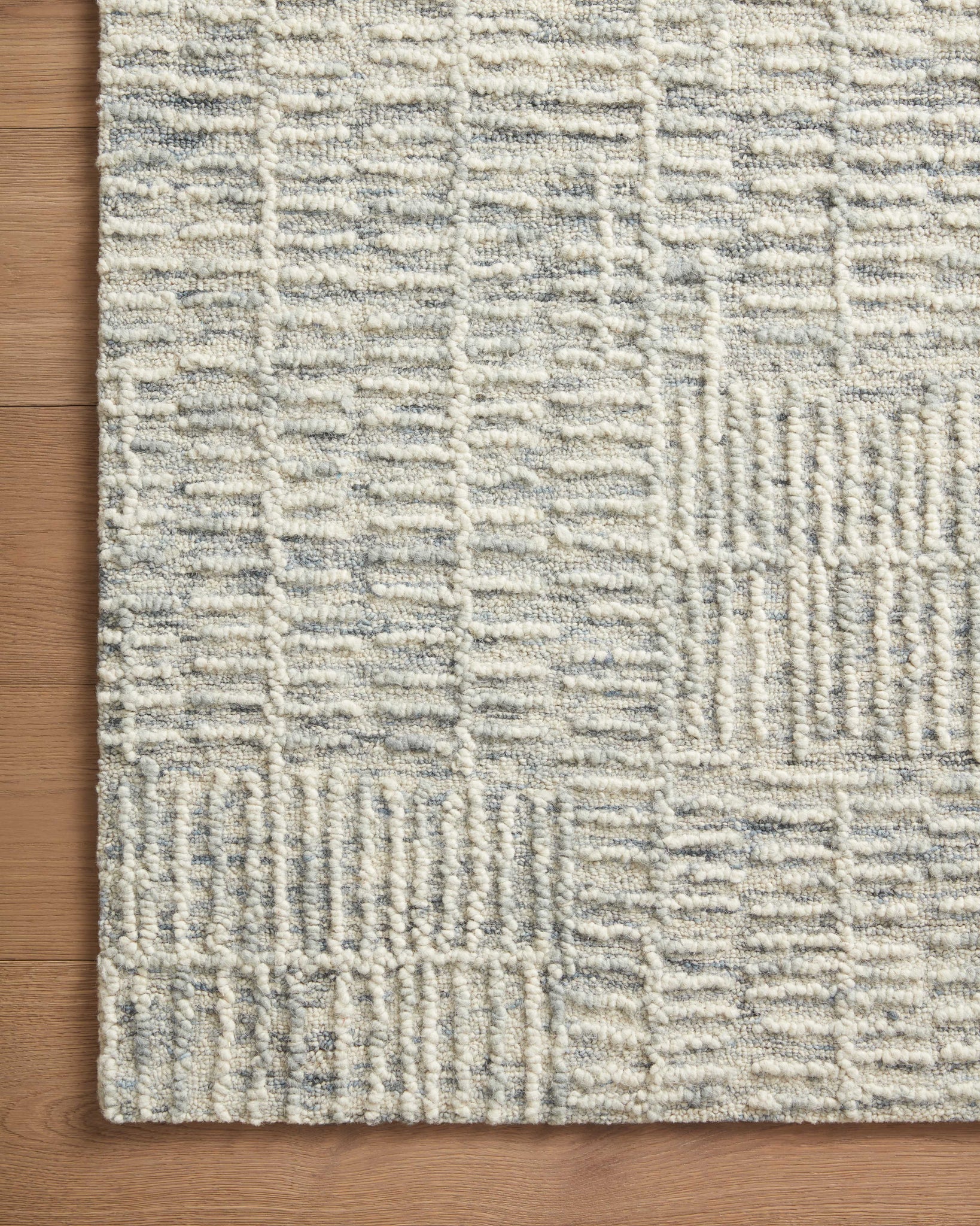 side view of Tallulah Sky / Ivory luxury Rug