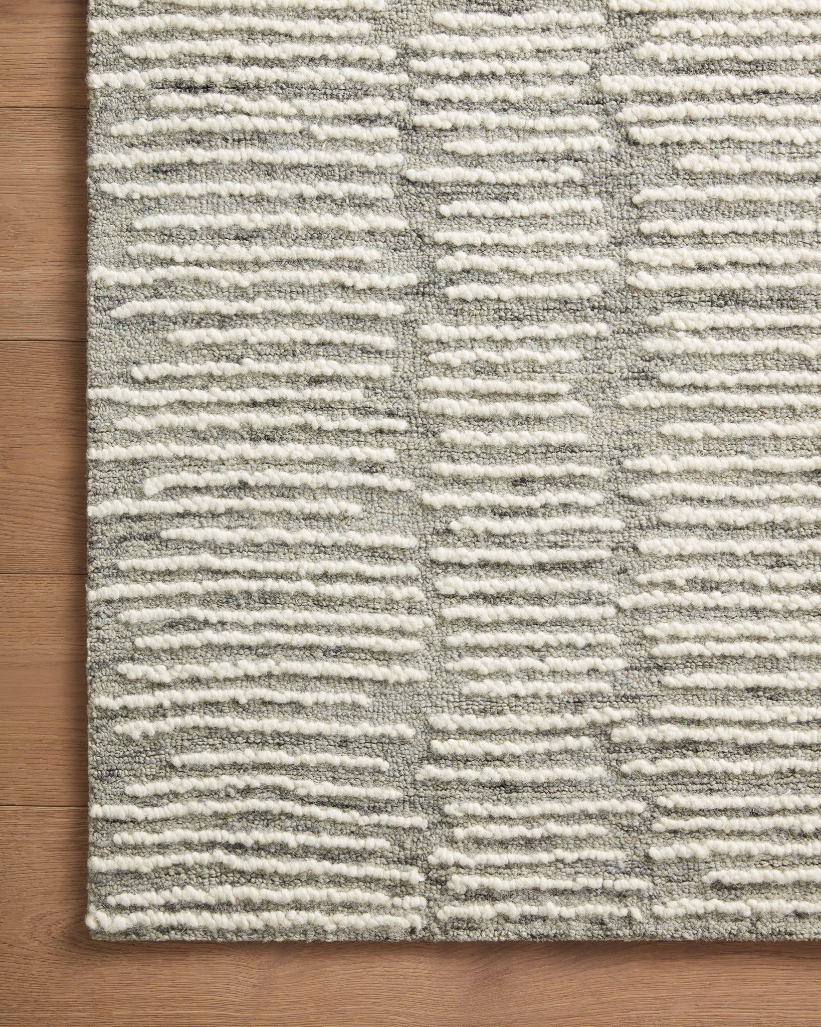 side view of Tallulah Stone / Ivory luxury Rug