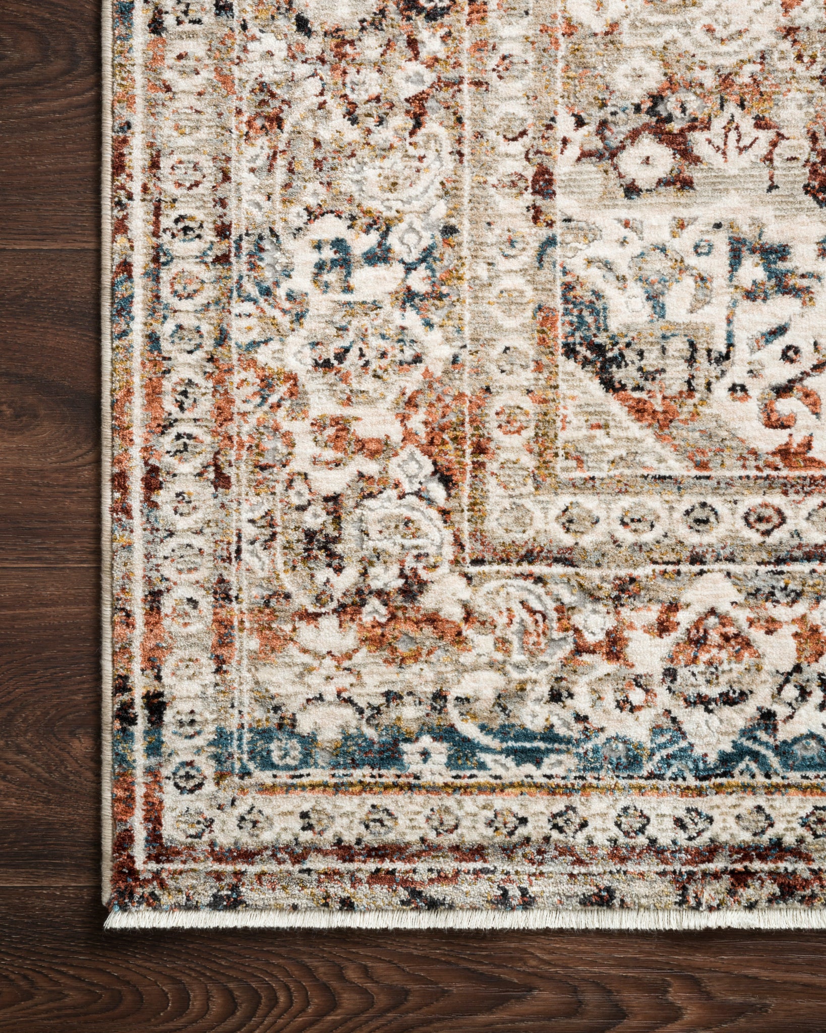 detail view of Theia Taupe / Brick luxury Rug