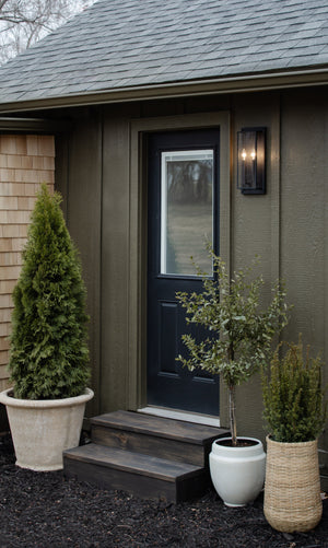 Winslow Exterior Wall Sconce 7.5" styled in a warmly lit hallway for warm, layered light at Laurie Yapp Home.