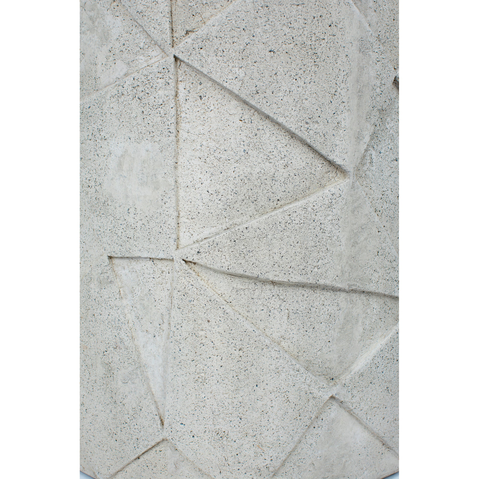 Nodin Side Table close-up of textured light gray concrete with angular design