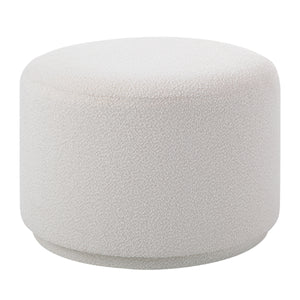 Audrina Ottoman in soft white fabric with textured surface, round shape, side view