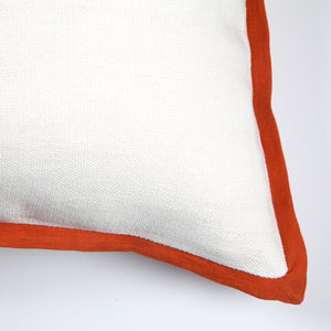 Elise Indoor Pillow close-up showing white texture and orange border