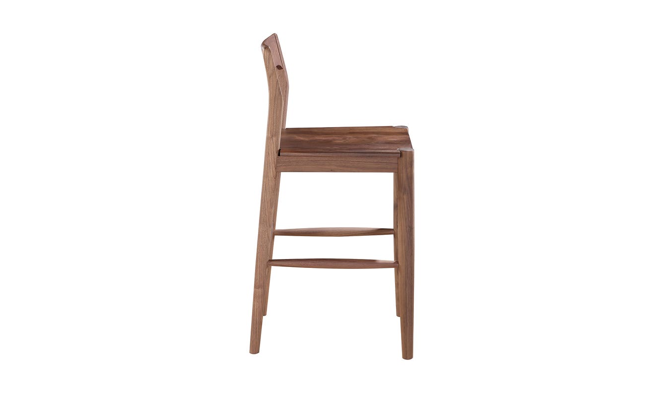 lifestyle view of Owing Counter Stool Walnut luxury Chair
