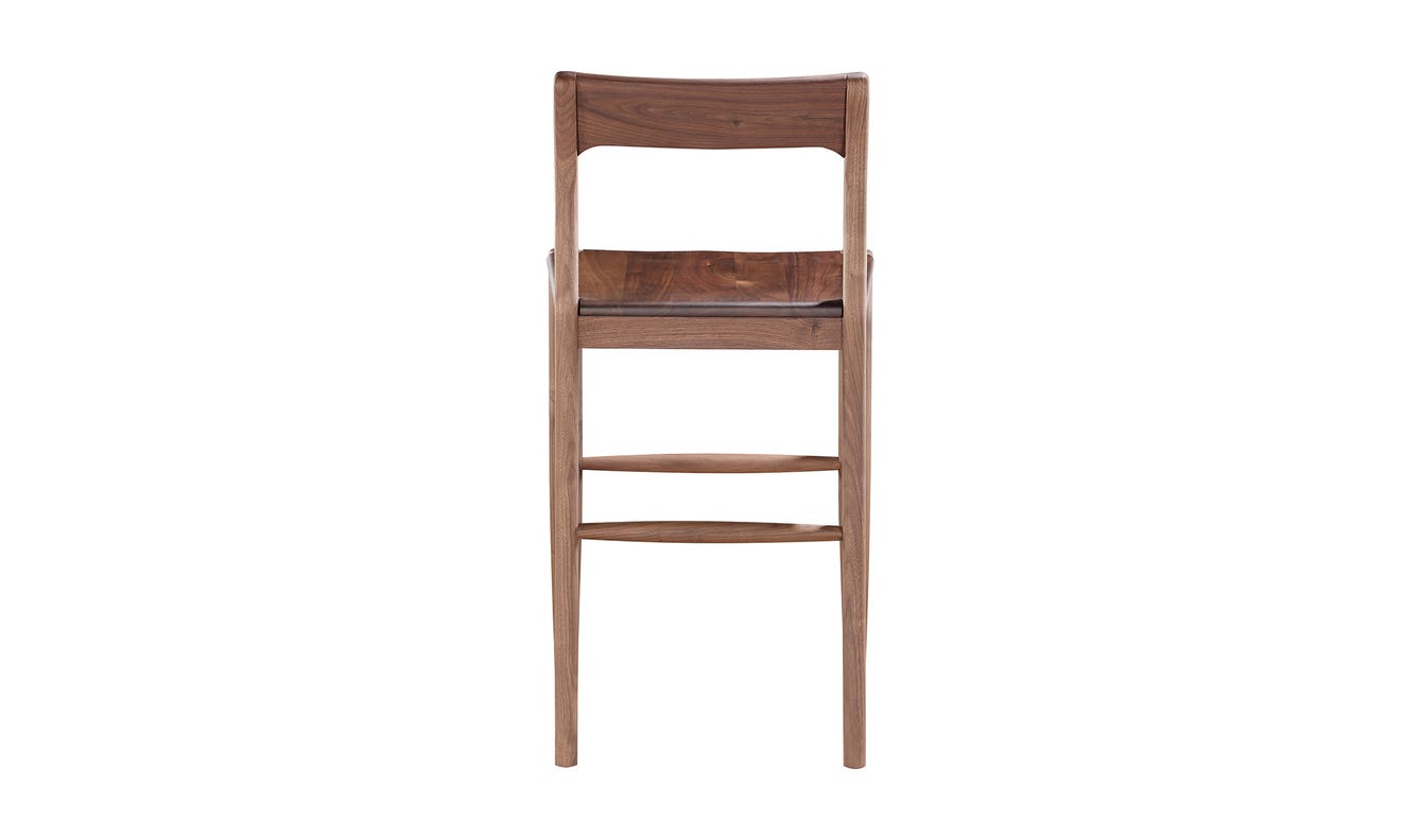 lifestyle view of Owing Counter Stool Walnut luxury Chair