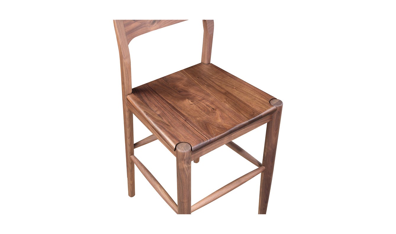 lifestyle view of Owing Counter Stool Walnut luxury Chair