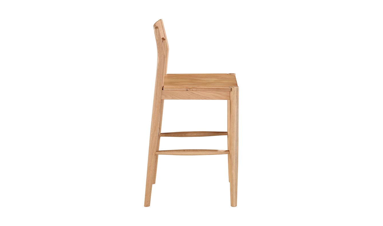 lifestyle view of Owing Counter Stool Natural Oak luxury Chair