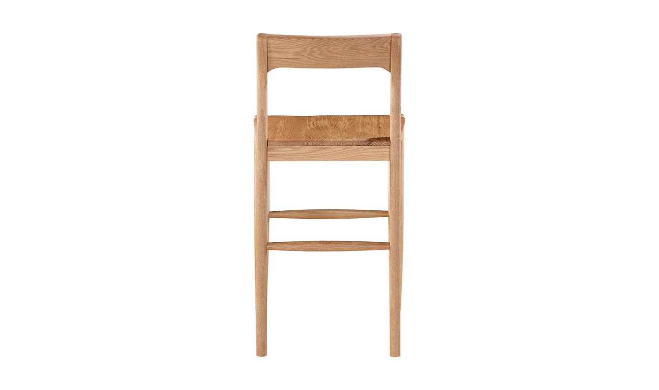 lifestyle view of Owing Counter Stool Natural Oak luxury Chair