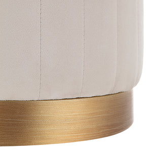 Close-up of Baylor Ottoman showing detailed beige fabric and gold trim