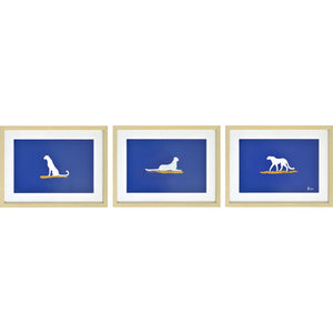 Makalu Wall Art featuring three framed silhouettes of dogs on a blue background