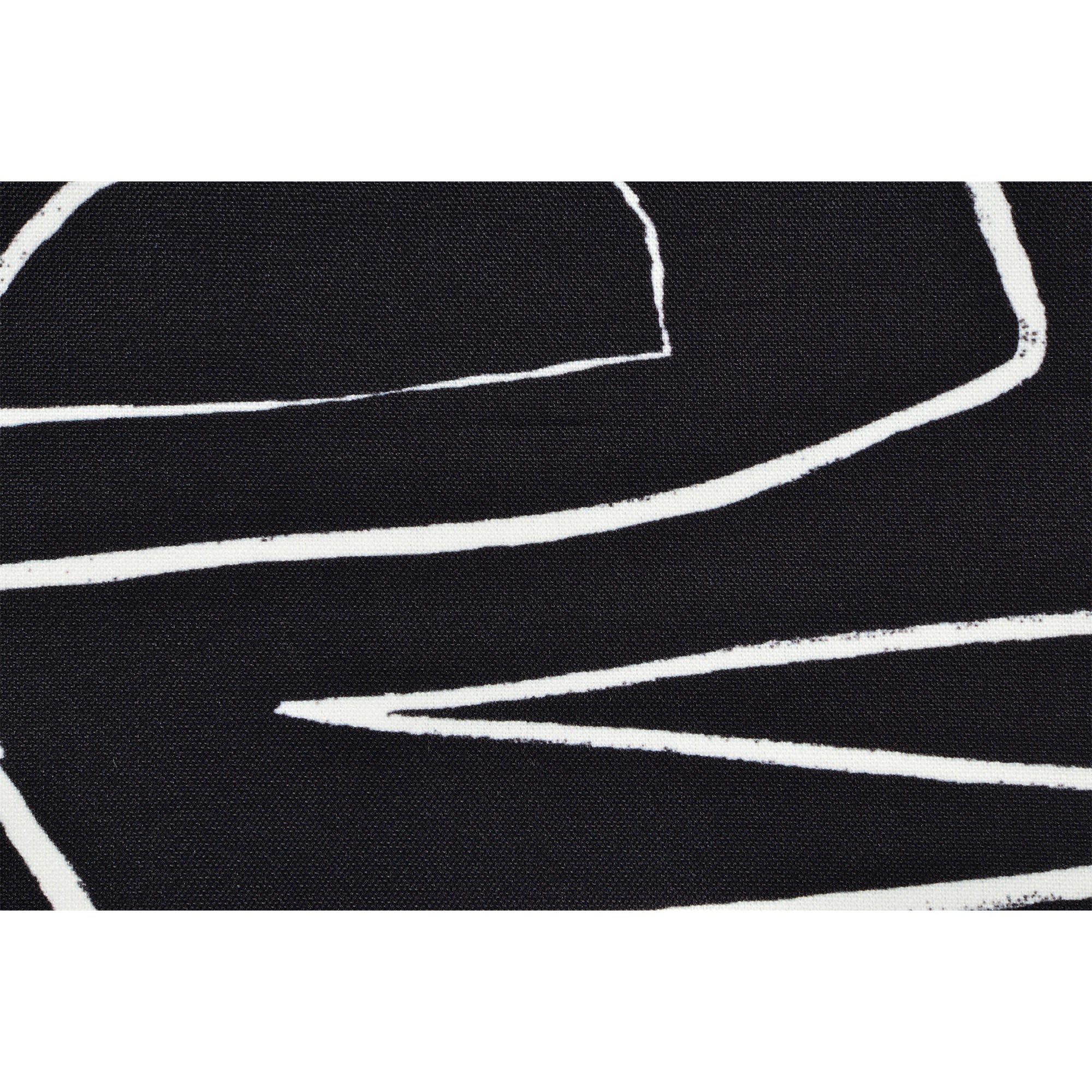 Close-up of Ray Indoor Pillow showing black fabric with white line patterns.