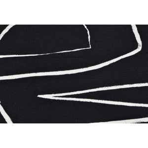 Close-up of Ray Indoor Pillow showing black fabric with white line patterns.