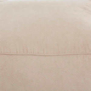 Close-up of Bundle Pouf in beige, highlighting the soft, velvety surface and seam details.