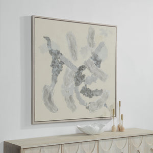 Maputo canvas art mounted on a wall above a wooden console with decorative items.