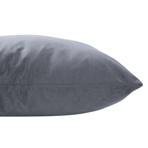 Anemone Indoor Pillow in soft gray fabric, showcasing a smooth texture and tapered edge, viewed from the side.
