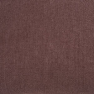 Close-up of Pan Indoor Pillow fabric in brown, highlighting its soft texture.