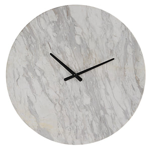 Dayton clock with a round white marble face and black hands