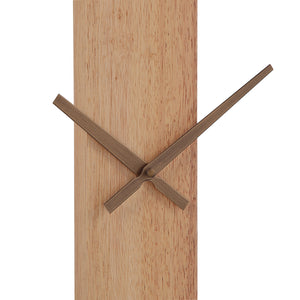 Detailed view of Pollux Wall Clock's wooden base and gold clock hands.