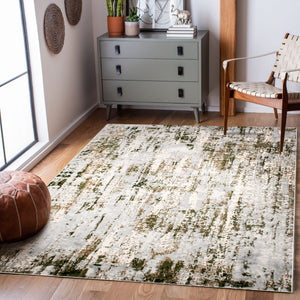 Ariella Indoor Rug featuring a textured pattern in shades of cream and green, placed on wooden flooring.