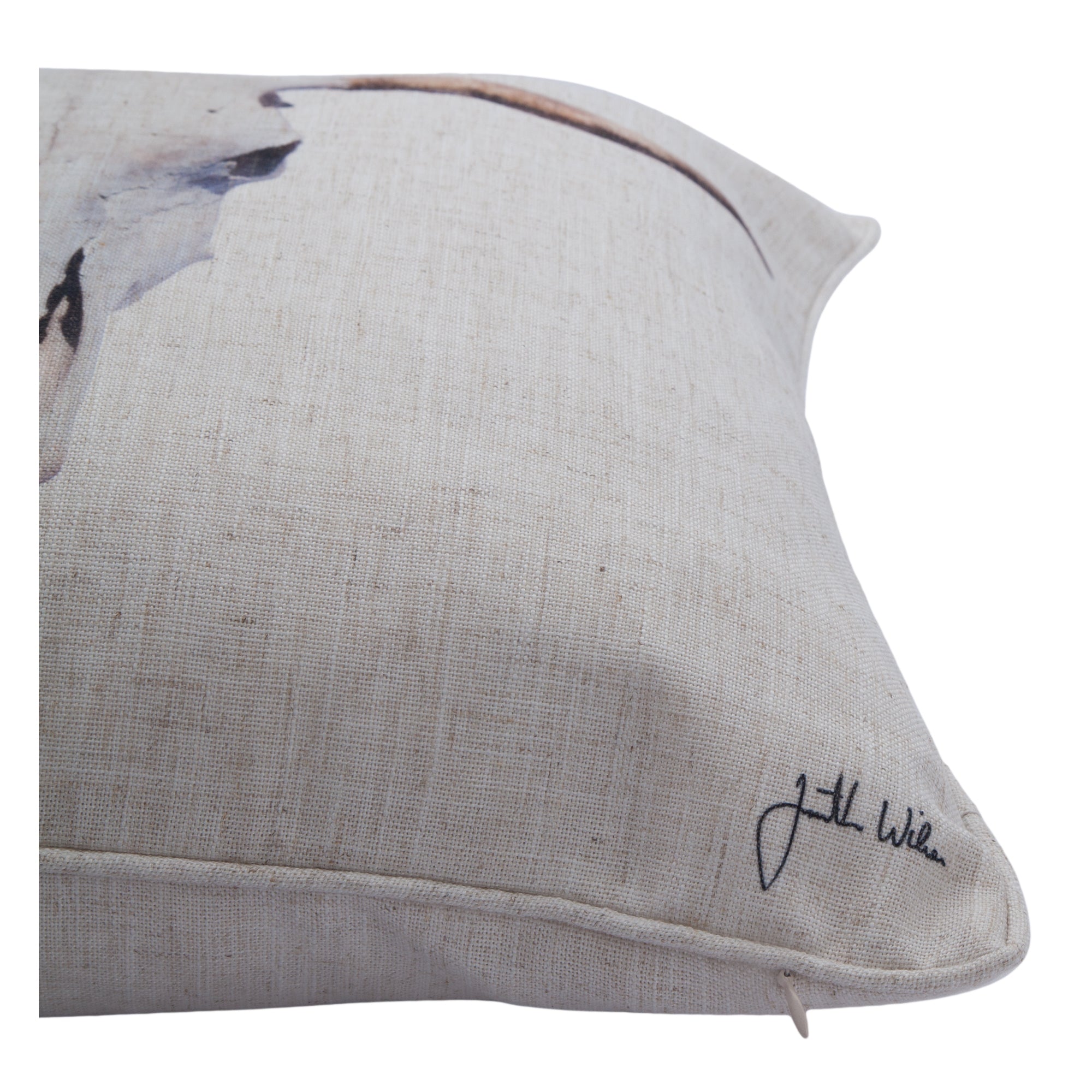 Elgin pillow with a close-up view of the bull skull design and signature detail.