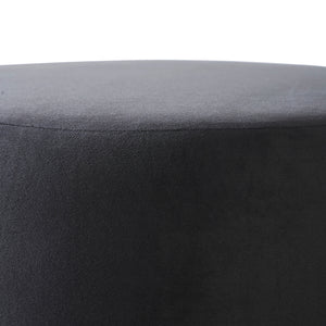 Colum Ottoman in dark gray velvet, close-up of the top surface, smooth texture.