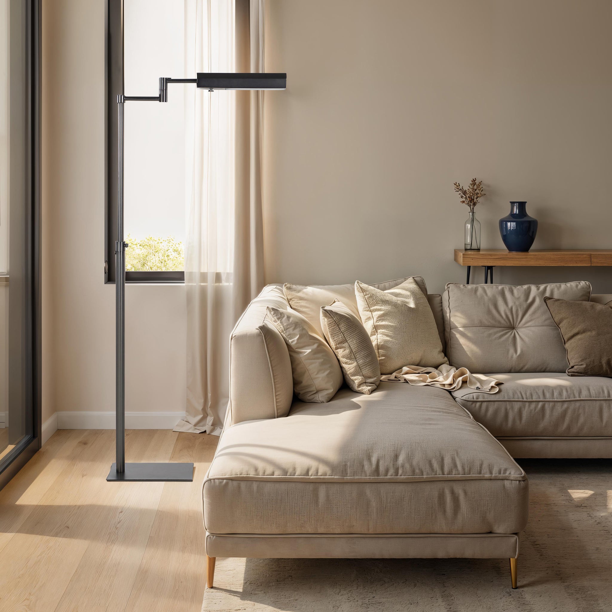 Roca floor lamp in a modern living room beside a beige sectional sofa