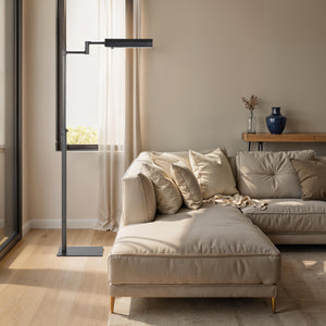 Roca floor lamp in a modern living room beside a beige sectional sofa