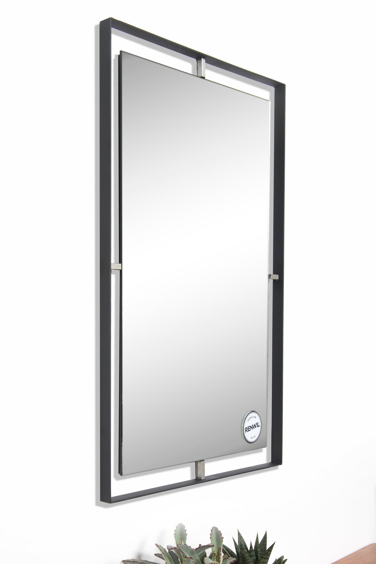 Heston Wall Mirror with a sleek black frame and gold accents, reflecting light.