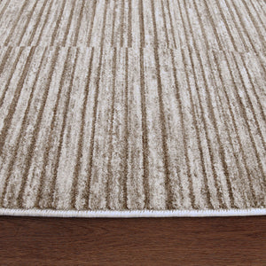 Blake rug featuring a textured striped pattern in beige and cream, with a white edge on a wooden surface.