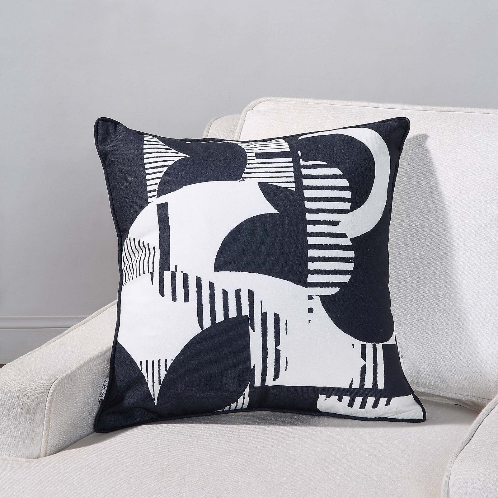 Tropo Indoor Pillow featuring a navy and white abstract pattern with stripes and curves.