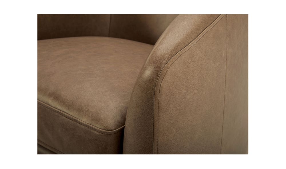 lifestyle view of Oscy Leather Swivel luxury Chair