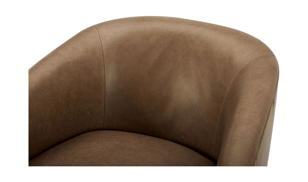 lifestyle view of Oscy Leather Swivel luxury Chair