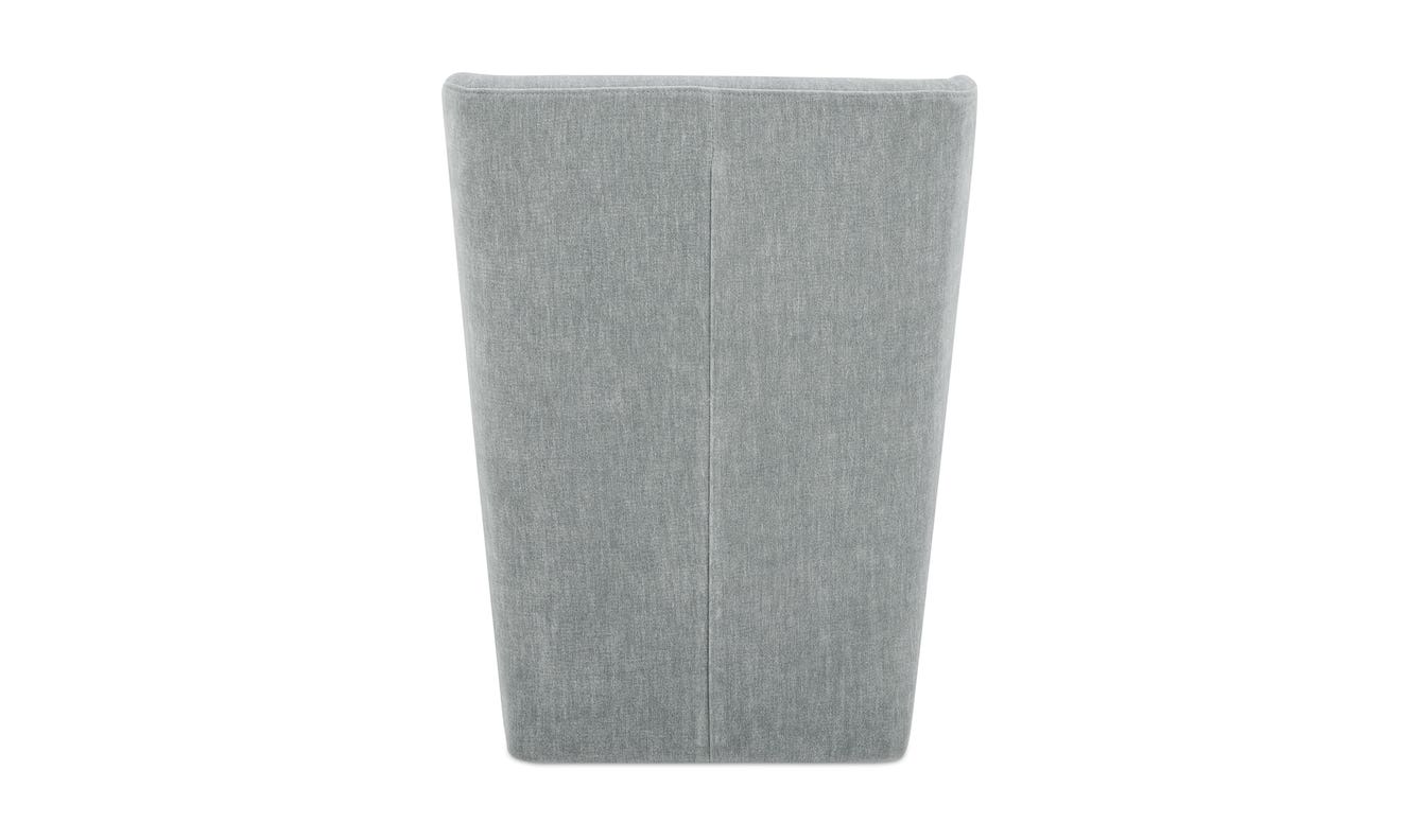 lifestyle view of Cormac Rolling Dining Chair Performance Fabric Slate Green luxury Chair