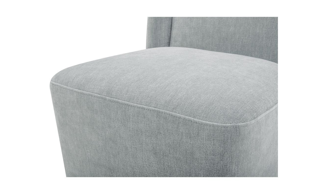 lifestyle view of Cormac Rolling Dining Chair Performance Fabric Slate Green luxury Chair